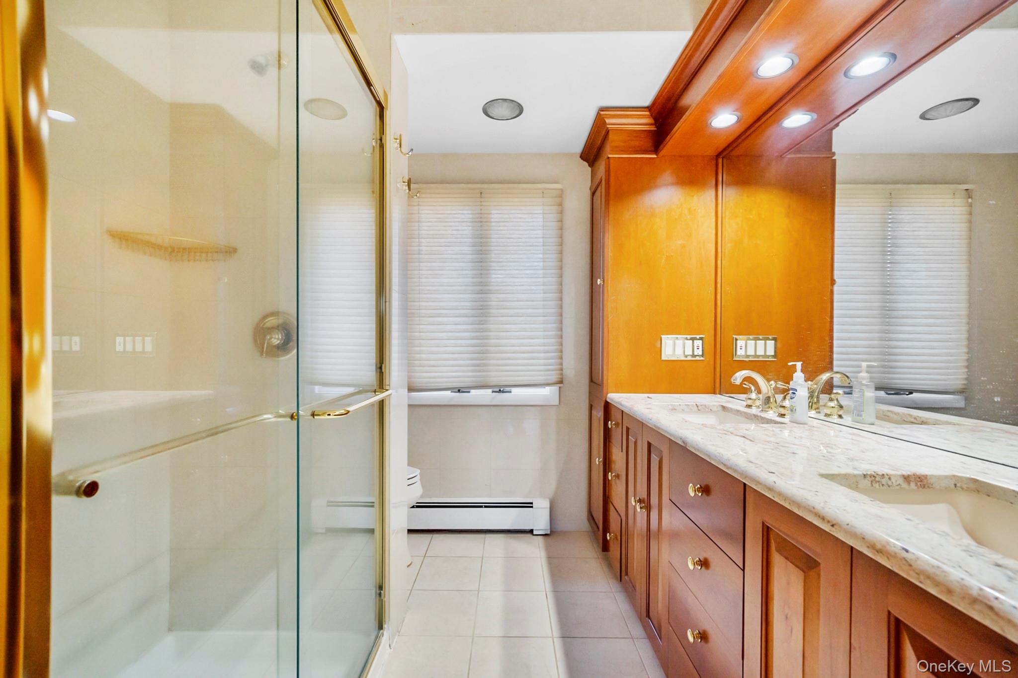 149 Munsell Road East Patchogue, NY 11772 - Photo 17 of 29 a bathroom with a granite countertop sink mirror and a shower