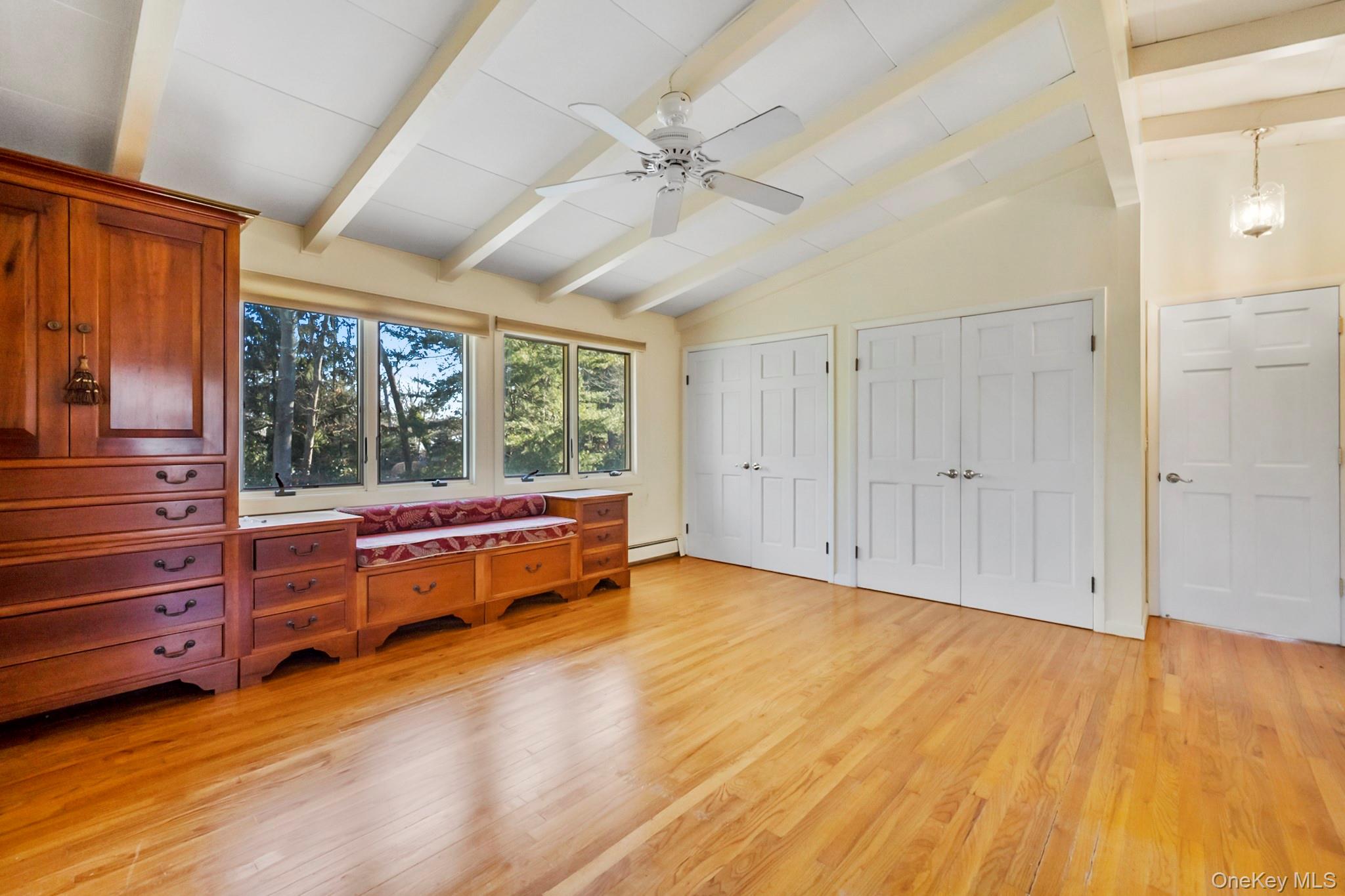 149 Munsell Road East Patchogue, NY 11772 - Photo 18 of 29 wooden floor with a bed and a window