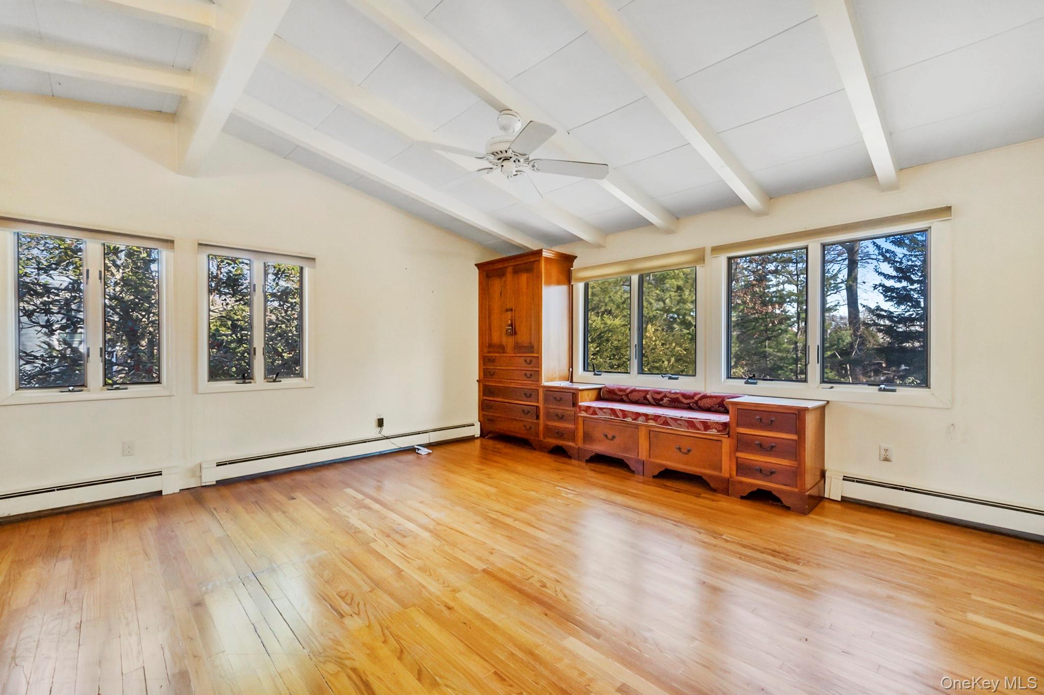 149 Munsell Road East Patchogue, NY 11772 - Photo 19 of 29 an empty room with wooden floor and balcony