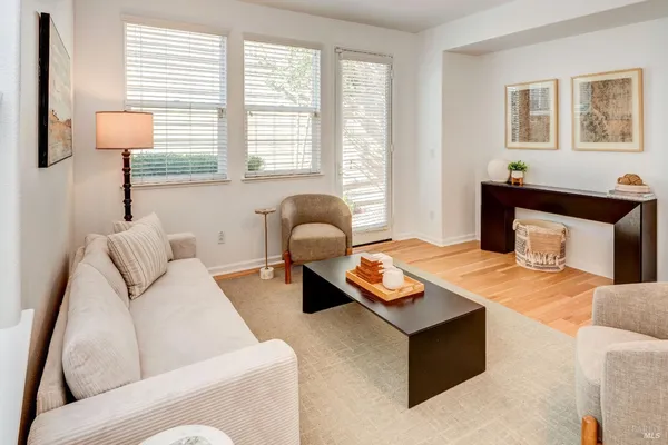 a living room with furniture and a window
