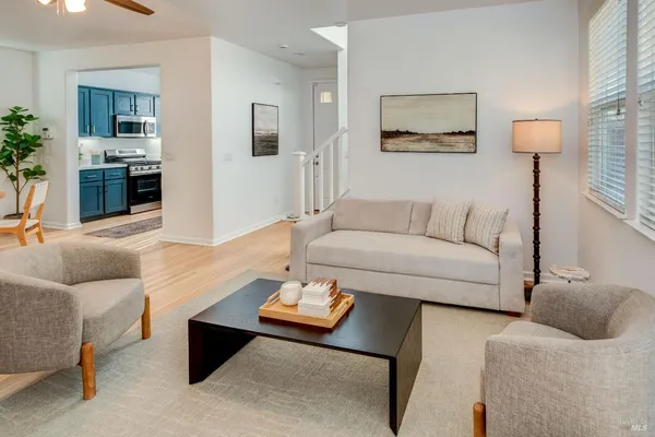 a living room with furniture and a table