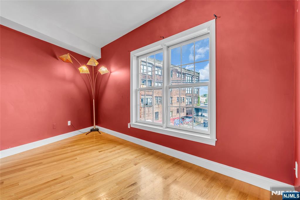 30 Austin Street, Unit 301 Newark, NJ 07114 - Photo 16 of 20 a view of an empty room with a window