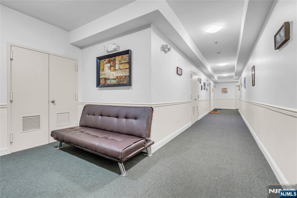 30 Austin Street, Unit 301 Newark, NJ 07114 - Photo 20 of 20 a living room with furniture and a stairs