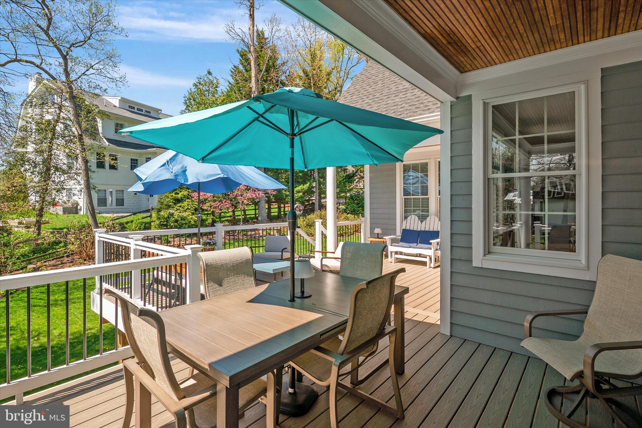 14 Severn River Road Severna Park, MD 21146 - Photo 20 of 73 a view of a deck with table and chairs under an umbrella with wooden floor
