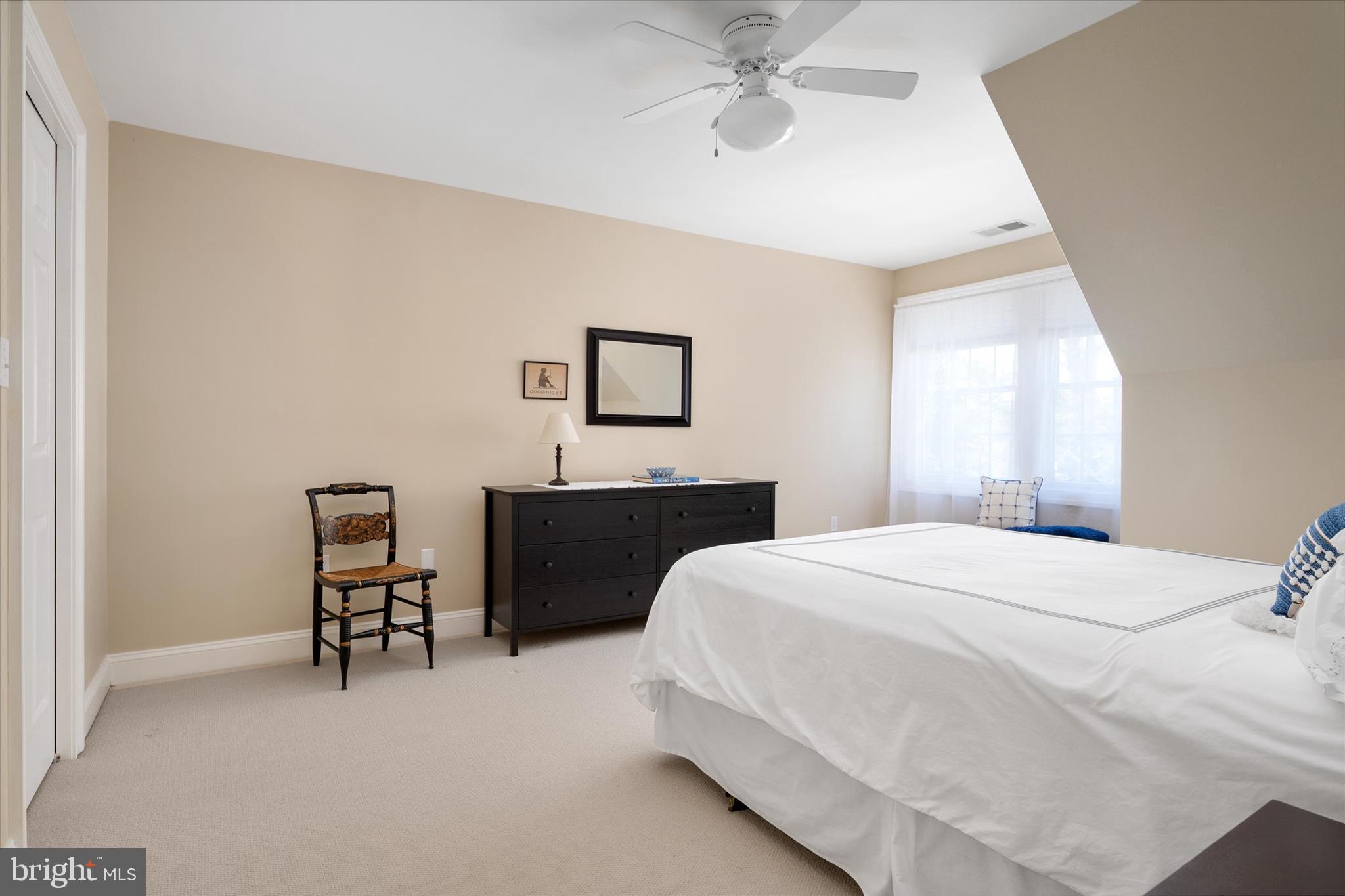 14 Severn River Road Severna Park, MD 21146 - Photo 43 of 73 a bedroom with a bed and a chandelier