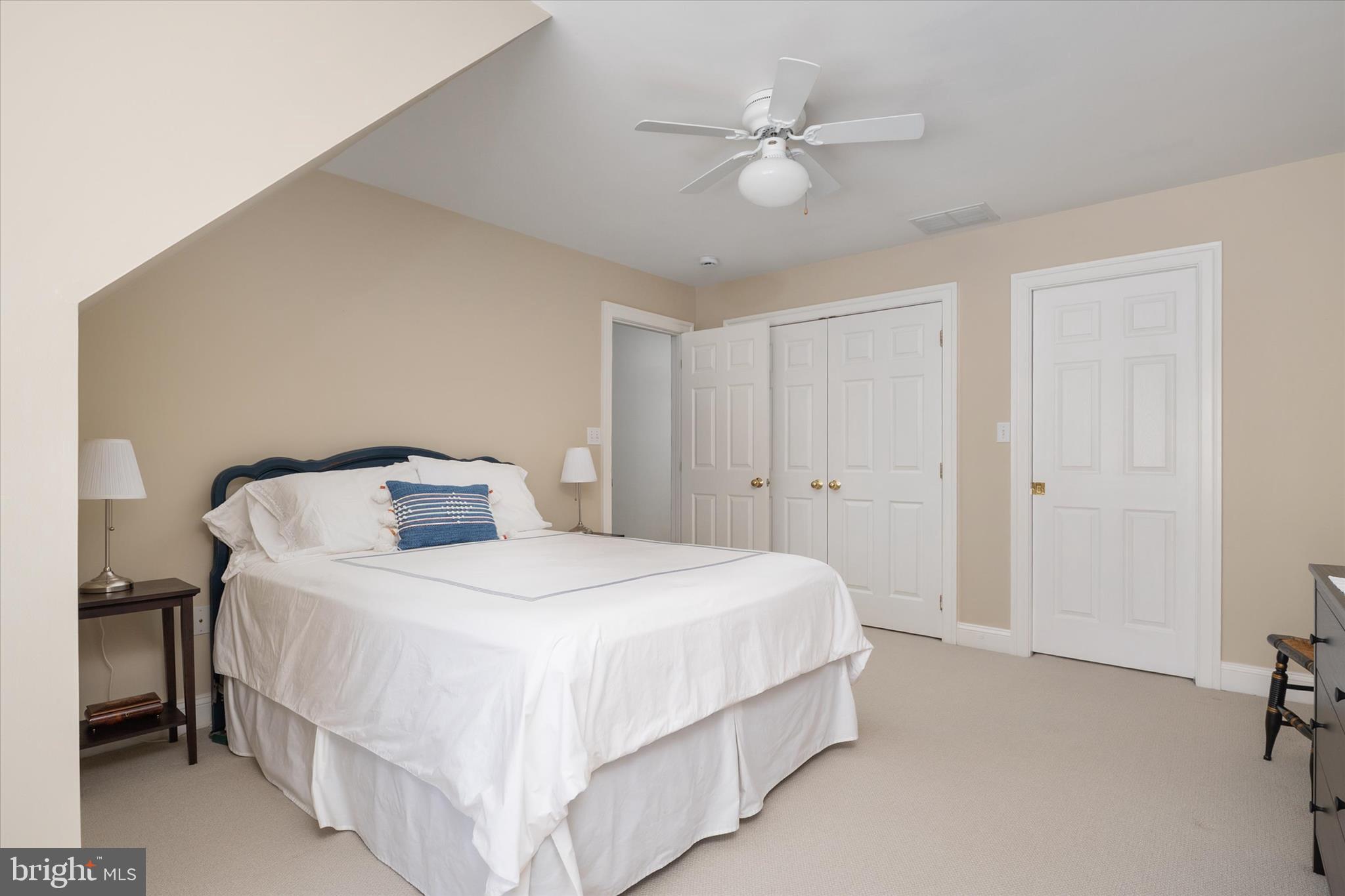 14 Severn River Road Severna Park, MD 21146 - Photo 44 of 73 a bedroom with a bed and a chandelier