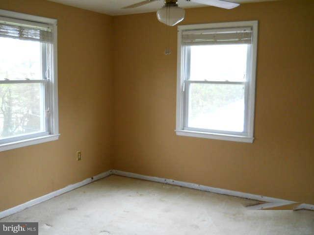 6707 Tweedbrook Road Baltimore, MD 21239 - Photo 11 of 19 a view of an empty room with a window