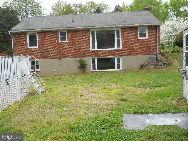 6707 Tweedbrook Road Baltimore, MD 21239 - Photo 18 of 19 a view of a house with a yard