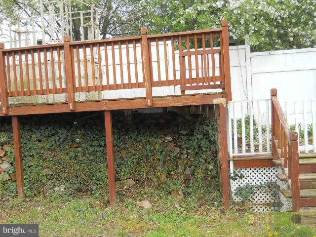 6707 Tweedbrook Road Baltimore, MD 21239 - Photo 19 of 19 a view of a porch with a bench