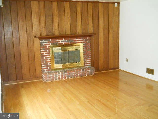 6707 Tweedbrook Road Baltimore, MD 21239 - Photo 5 of 19 a view of a room with a wooden door