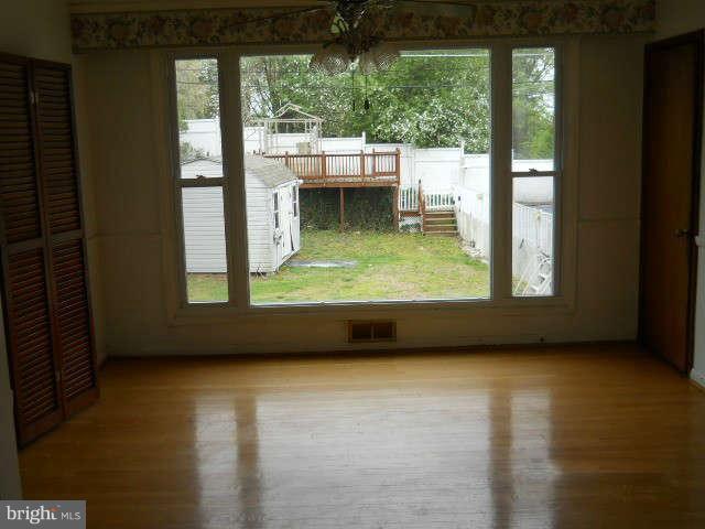 6707 Tweedbrook Road Baltimore, MD 21239 - Photo 6 of 19 a view of a porch with a yard