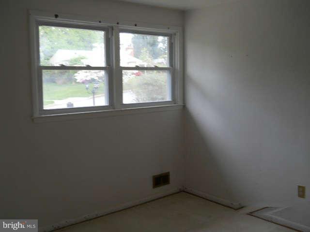 6707 Tweedbrook Road Baltimore, MD 21239 - Photo 10 of 19 an empty room with a window