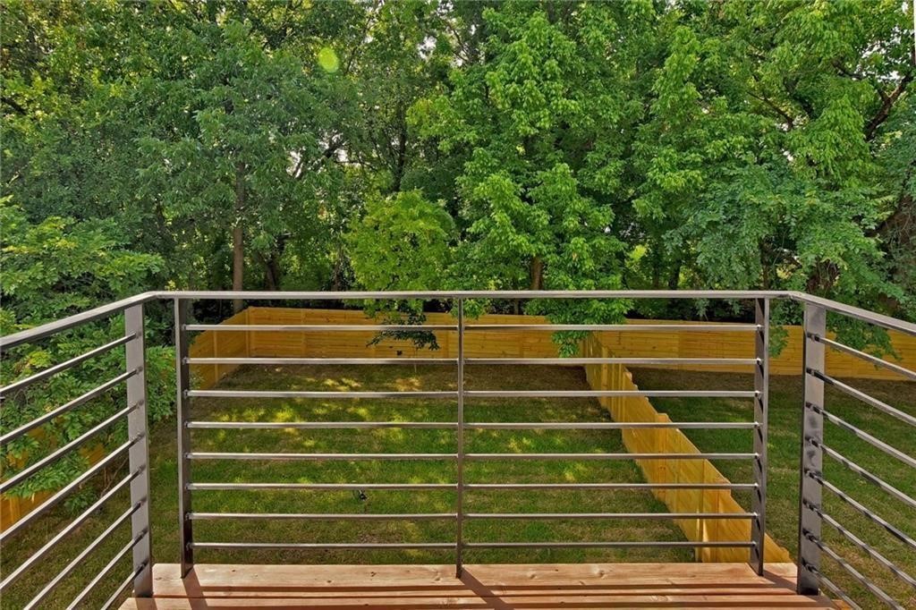 6405 Chesterfield Avenue, Unit A Austin, TX 78752 - Photo 14 of 15 a view of outdoor space with wooden floor and fence