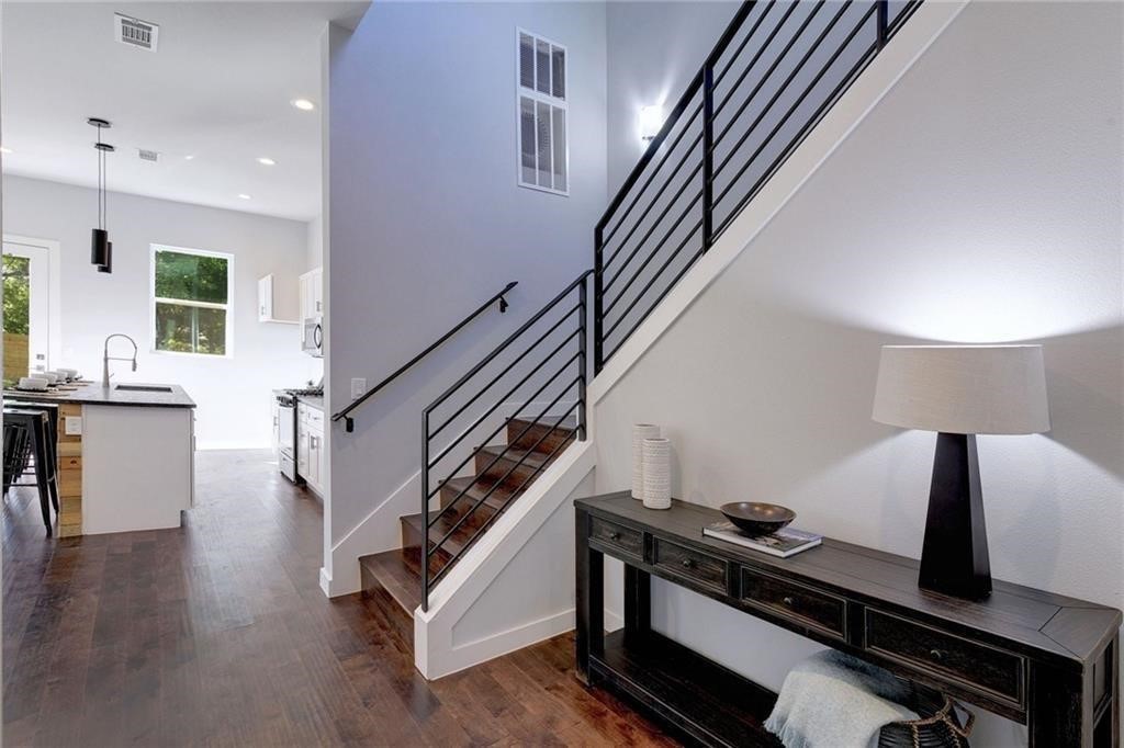 6405 Chesterfield Avenue, Unit A Austin, TX 78752 - Photo 2 of 15 a living room with stairs and a wooden floor