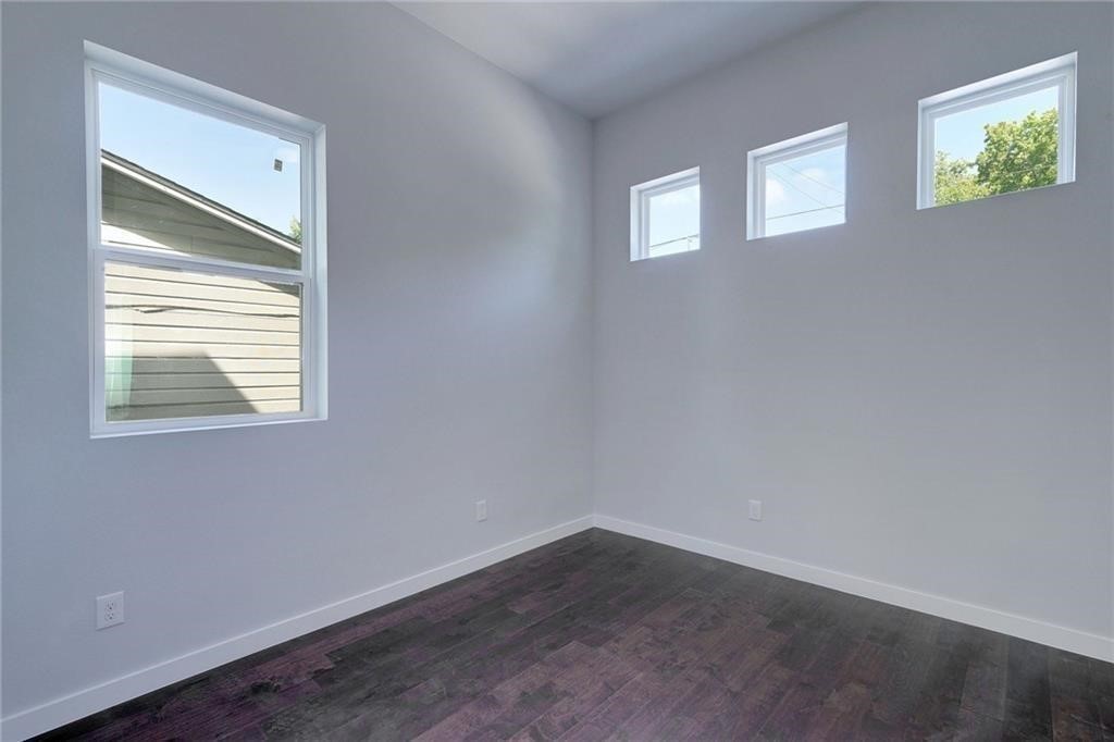 6405 Chesterfield Avenue, Unit A Austin, TX 78752 - Photo 6 of 15 an empty room that has a window