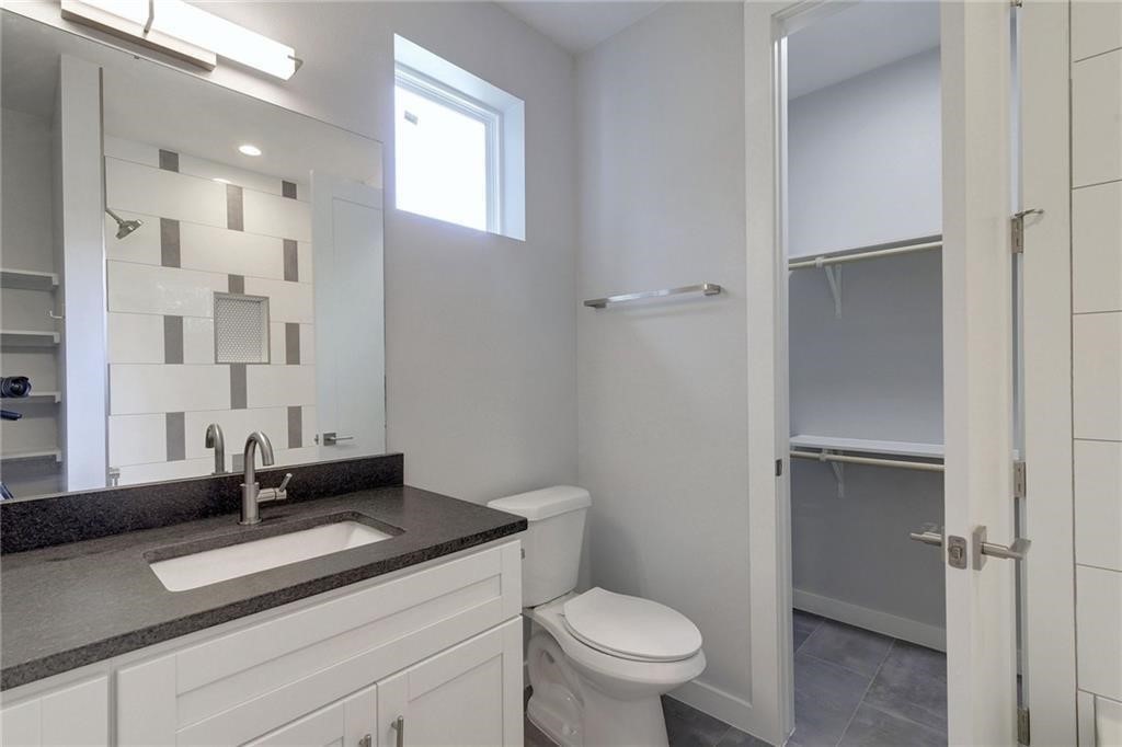 6405 Chesterfield Avenue, Unit A Austin, TX 78752 - Photo 7 of 15 a bathroom with a sink toilet and shower