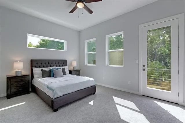a bedroom with a bed lamp and window