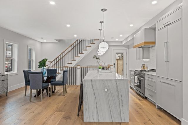 a view of kitchen with furniture and wooden floor