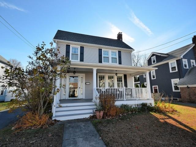 71 Henderson Road Fairfield, CT 06824 - Photo 1 of 1 a front view of a house with a yard