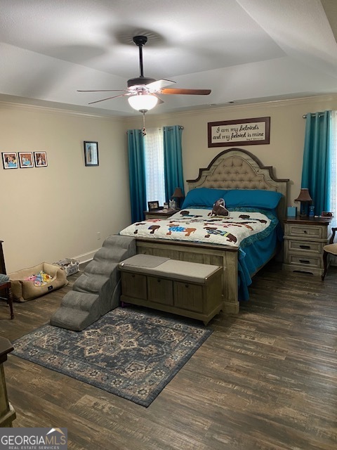 479 High Point Road Milledgeville, GA 31061 - Photo 15 of 27 a bedroom with bed and a chandelier