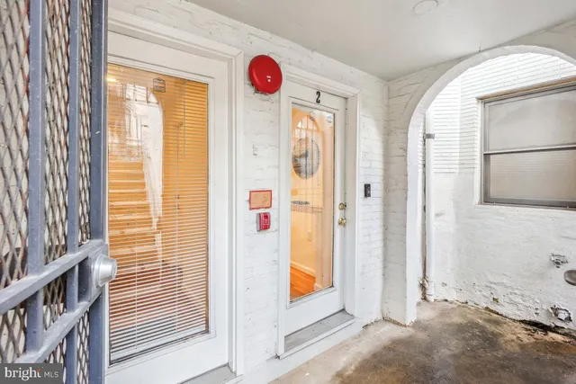 a view of a livingroom with wooden floor and a window