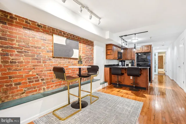 a living room with fireplace furniture and a flat screen tv