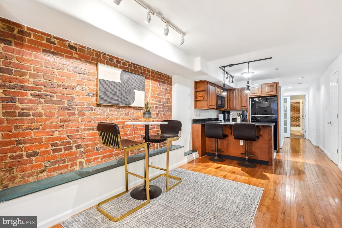 1514 21st Street Northwest, Unit 1 Washington, DC 20036 - Photo 8 of 29 a living room with fireplace furniture and a flat screen tv