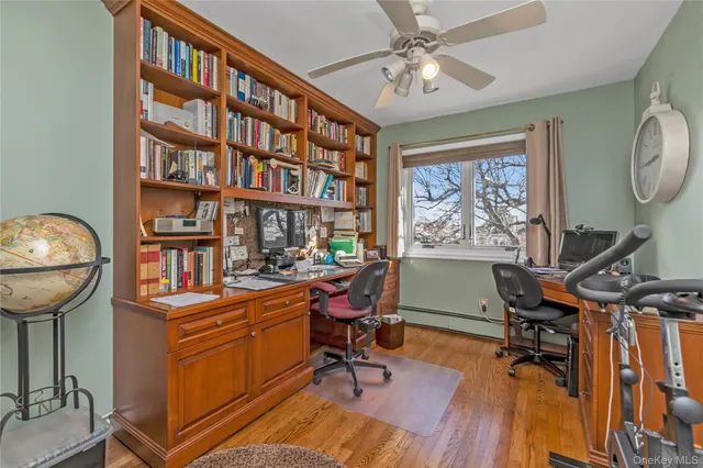 a view of a workspace with furniture and a workspace