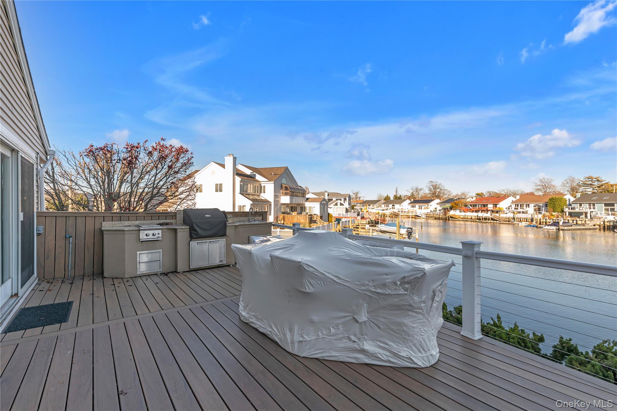 3522 Frederick Street Oceanside, NY 11572 - Photo 18 of 23 Deck with a residential view, a water view, and exterior kitchen