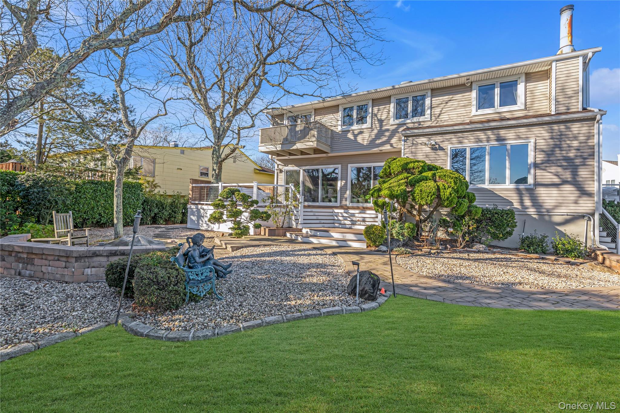 3522 Frederick Street Oceanside, NY 11572 - Photo 19 of 23 Back of property featuring a patio, a yard, and a balcony