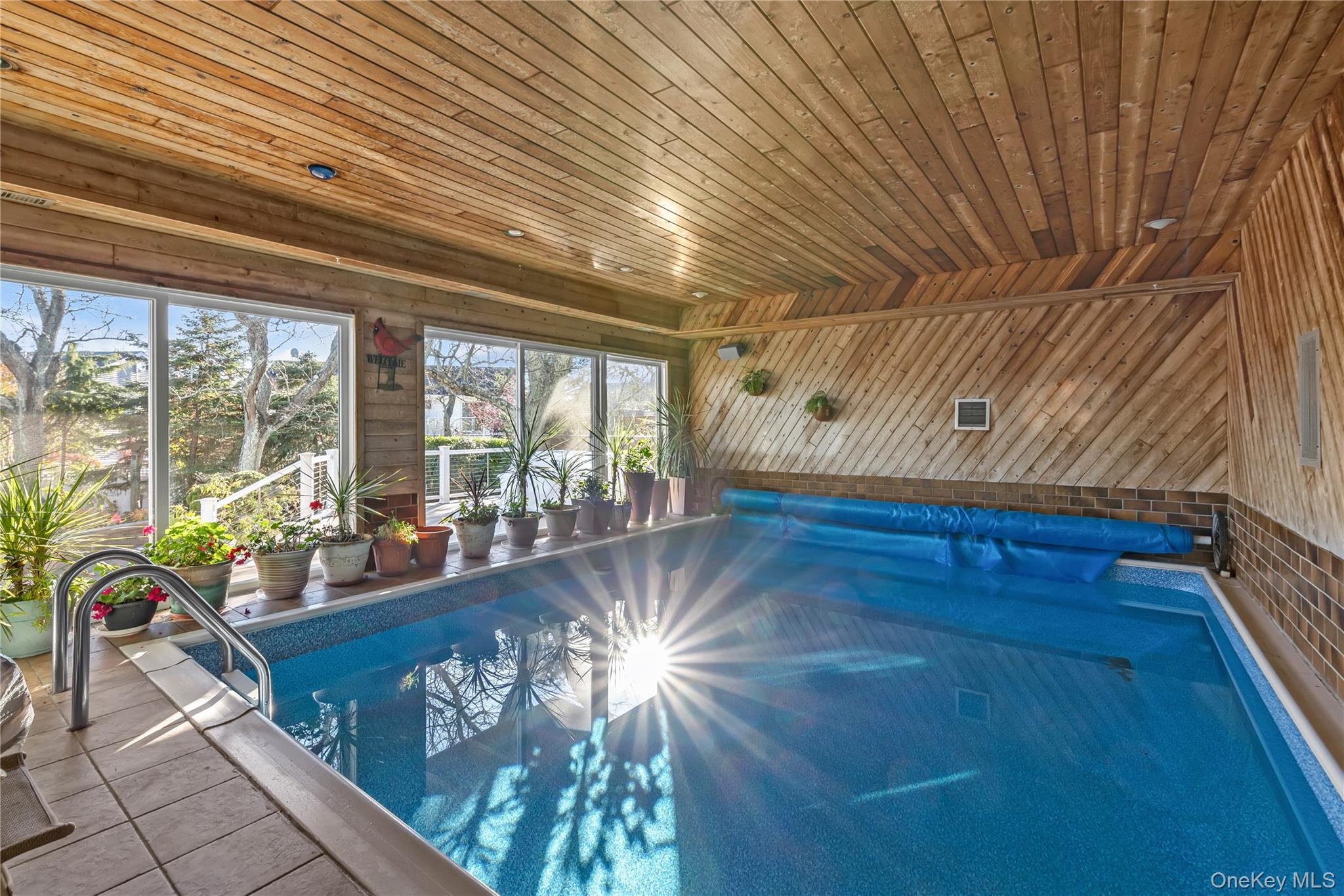 3522 Frederick Street Oceanside, NY 11572 - Photo 4 of 23 Indoor pool with a sunroom