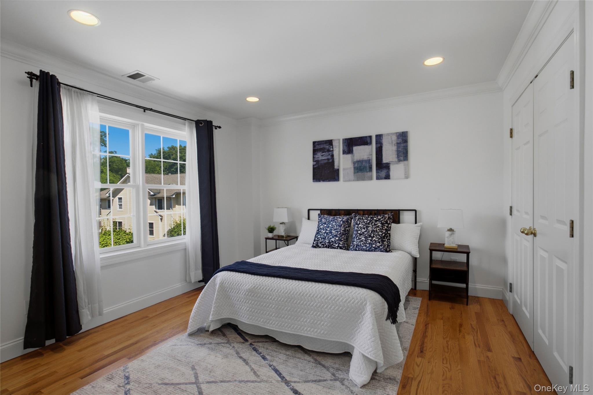 11 Prince Street, Unit C5 New Rochelle, NY 10801 - Photo 11 of 21 Spacious primary bedroom with ample closet space.