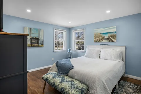 a bedroom with a large bed and a window