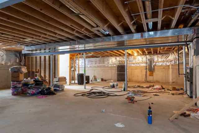 an aerial view of a house with yard