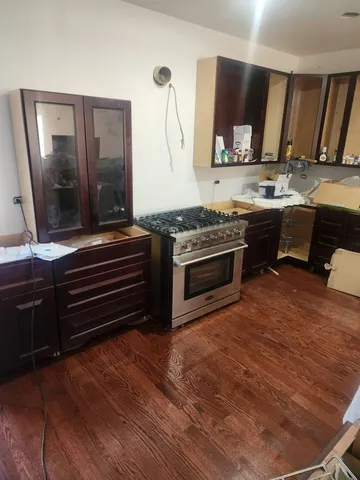 a kitchen with a stove and a microwave