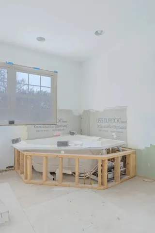 a room with a table and chairs