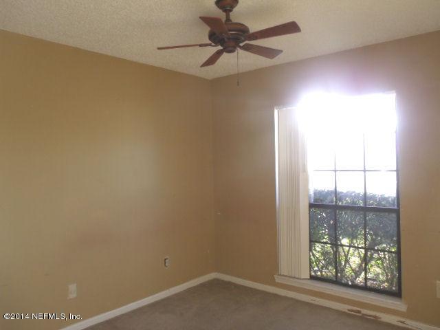 7893 Springtime Lane Jacksonville, FL 32221 - Photo 13 of 14 an empty room with a window