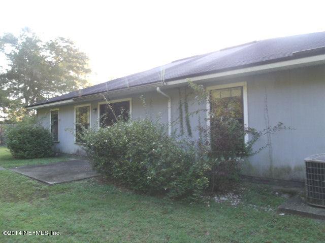 7893 Springtime Lane Jacksonville, FL 32221 - Photo 14 of 14 front view of a house with potted plants