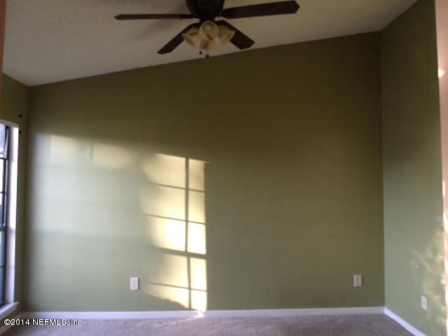 7893 Springtime Lane Jacksonville, FL 32221 - Photo 3 of 14 a view of an empty room and window