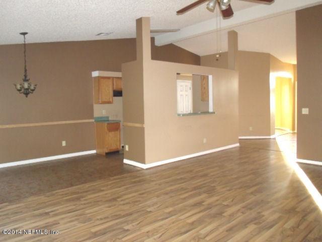 7893 Springtime Lane Jacksonville, FL 32221 - Photo 5 of 14 a view of a livingroom with wooden floor
