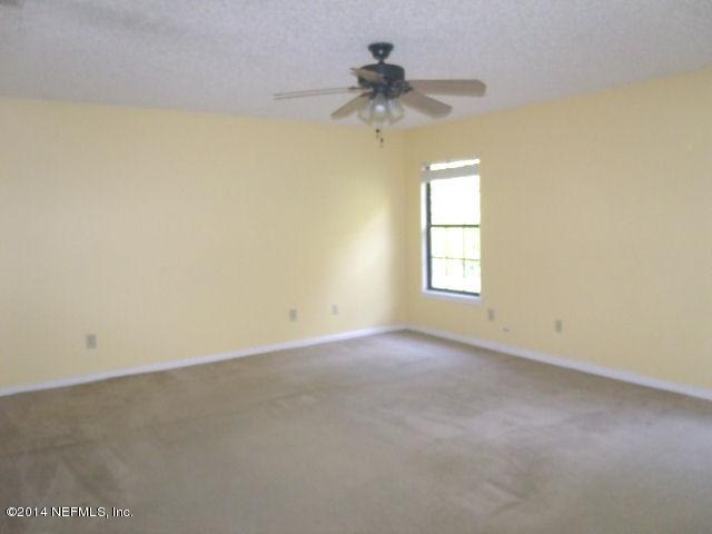 7893 Springtime Lane Jacksonville, FL 32221 - Photo 10 of 14 an empty room with a window