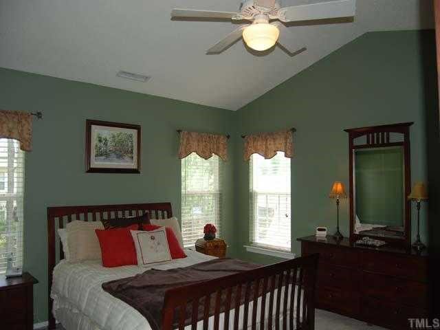 5608 Enoree Lane Raleigh, NC 27616 - Photo 6 of 12 This lovely master bedroom has a cathedral ceiling, ceiling fan with light, designer color wall paint, neutral carpet and three single windows with 22 blinds