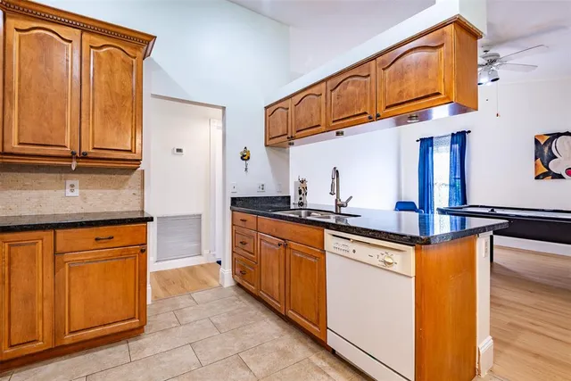 a swimming pool with table and chairs