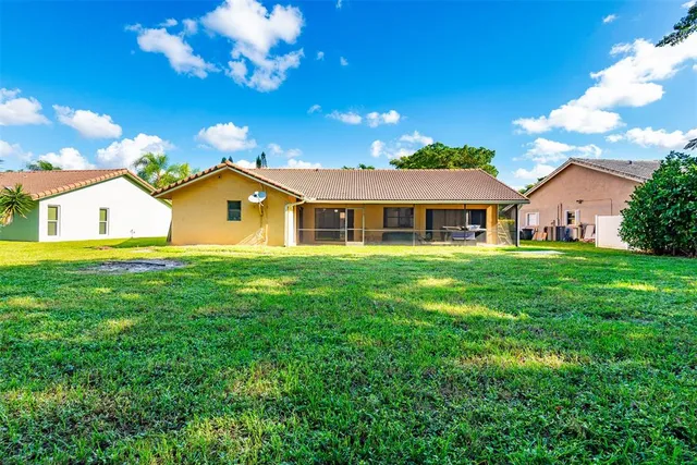a view of a house with a big yard