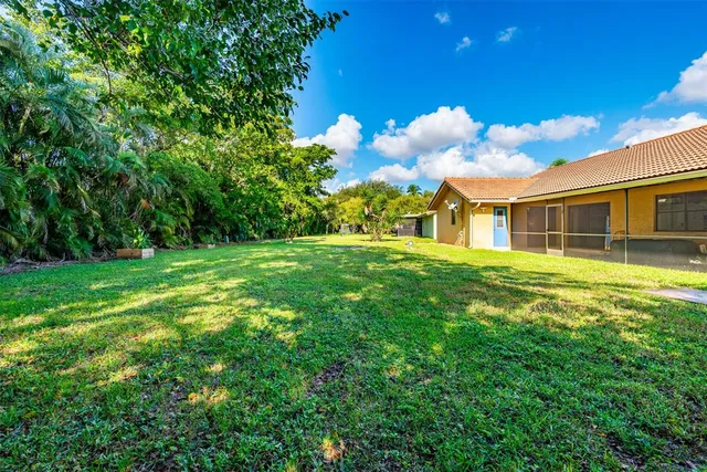 a backyard of a house with lots of green space