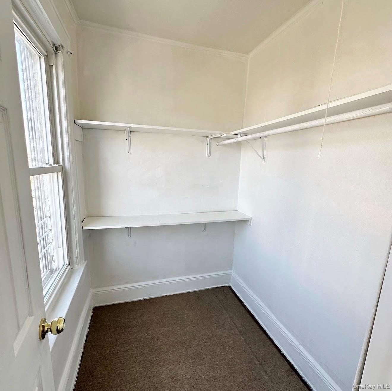 103-08 97th Avenue, Unit 2 Queens, NY 11416 - Photo 6 of 6 Walk in closet featuring dark colored carpet