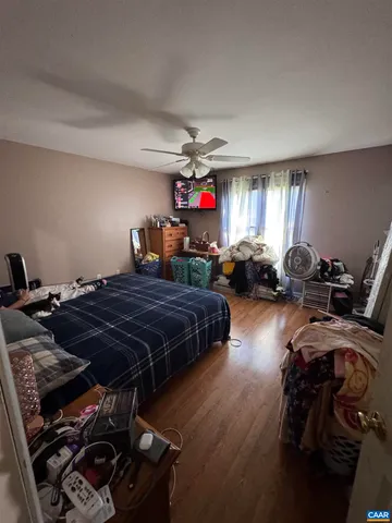 a living room with lots of furniture and kitchen view