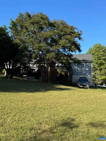 a view of a swimming pool with an outdoor space and seating area