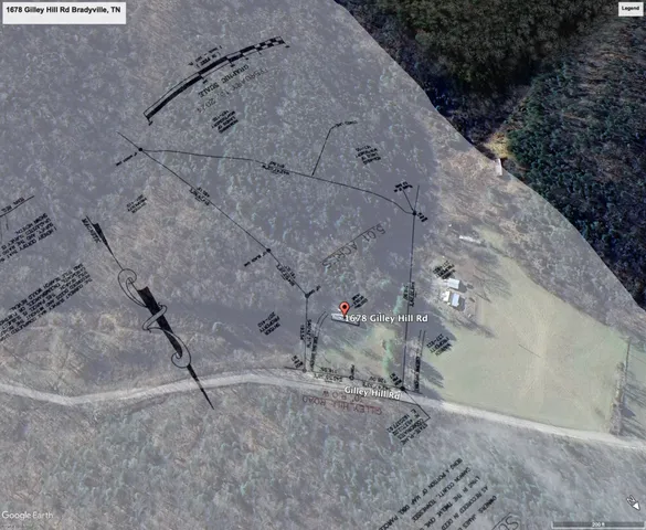 a view of yard with tree and a wooden fence