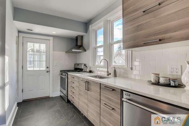 37 Wiggins Street, Unit 2 Princeton, NJ 08540 - Photo 14 of 25 a kitchen with a sink cabinets and window